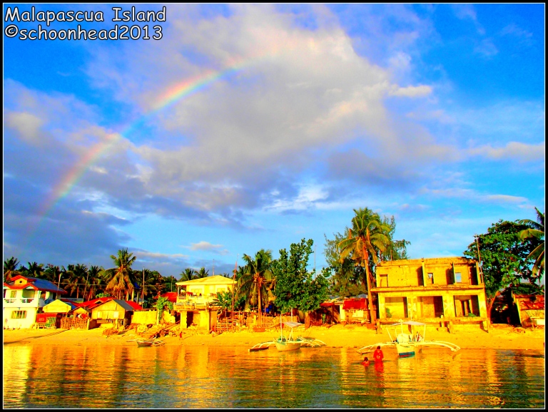 Rainbow and sunset collide in Barrio Logon
